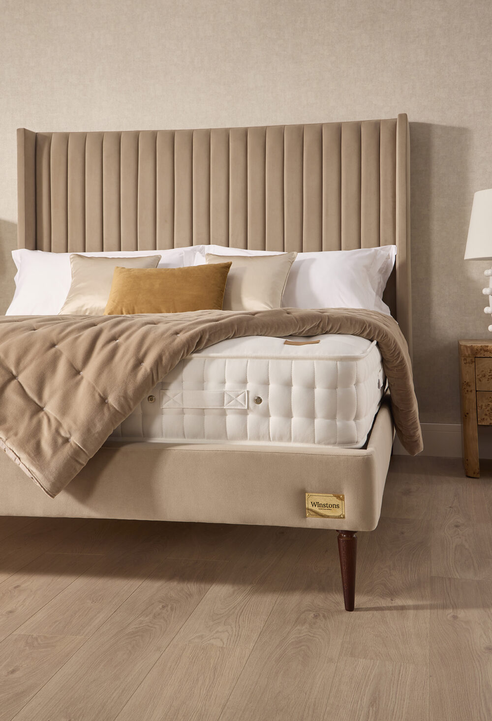 Henley statement headboard with Artisan mattress and quilted blanket from www.winstonsbeds.com/en-us