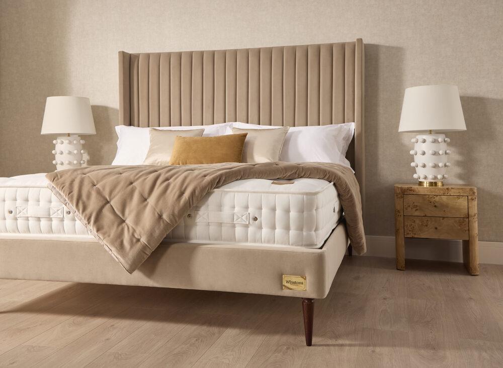 Close up of Henley bed base, tapered wooden leg and Artisan mattress from www.winstonsbeds.com/en-us