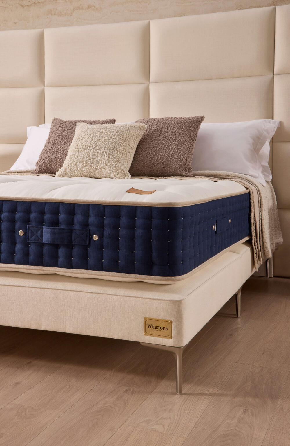 Grand Luxe mattress with white tufted top and navy hand-tufted side from www.winstonsbeds.com/en-us