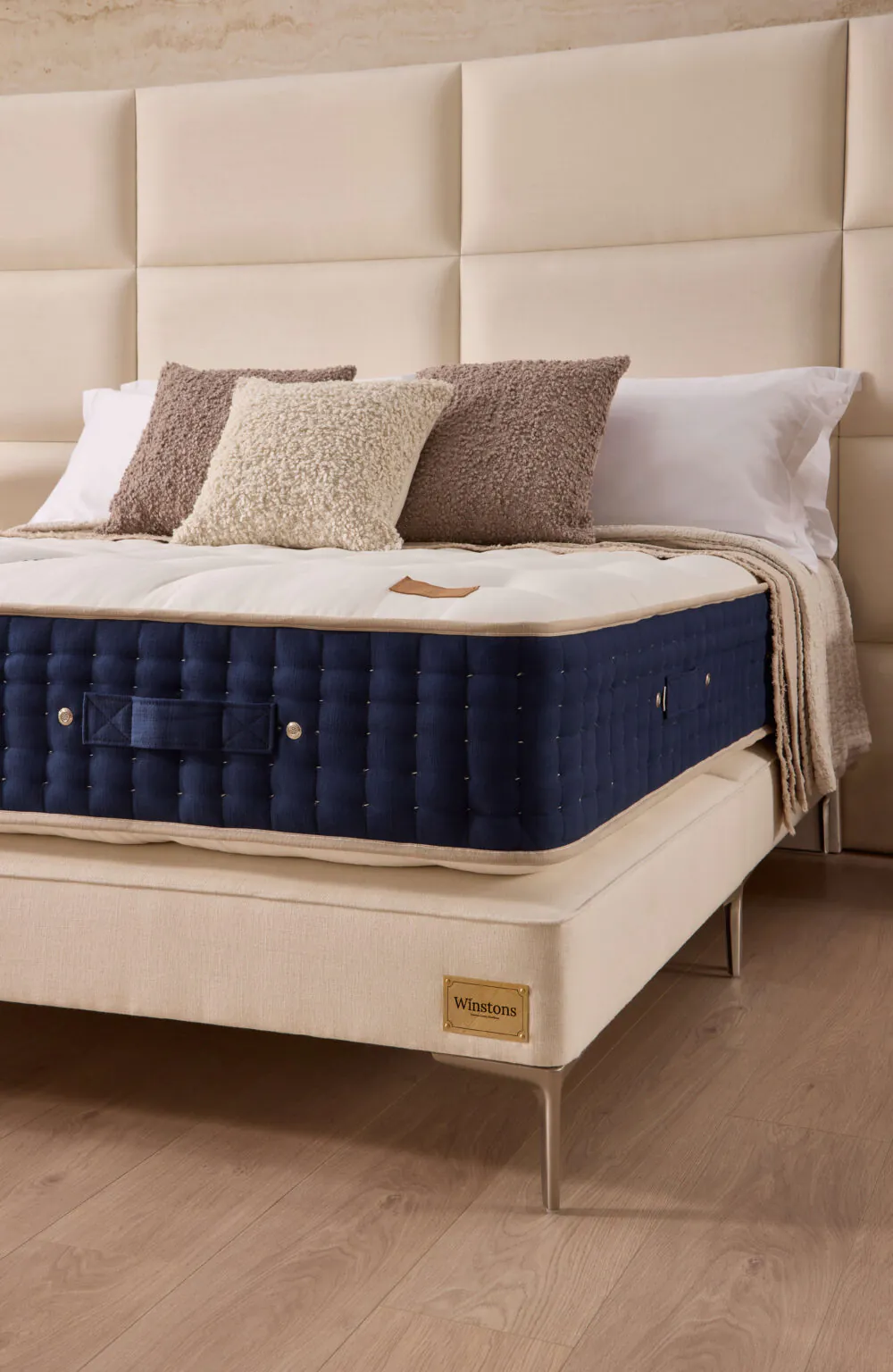 Grand Luxe mattress with white tufted top and navy hand-tufted side from www.winstonsbeds.com/en-us