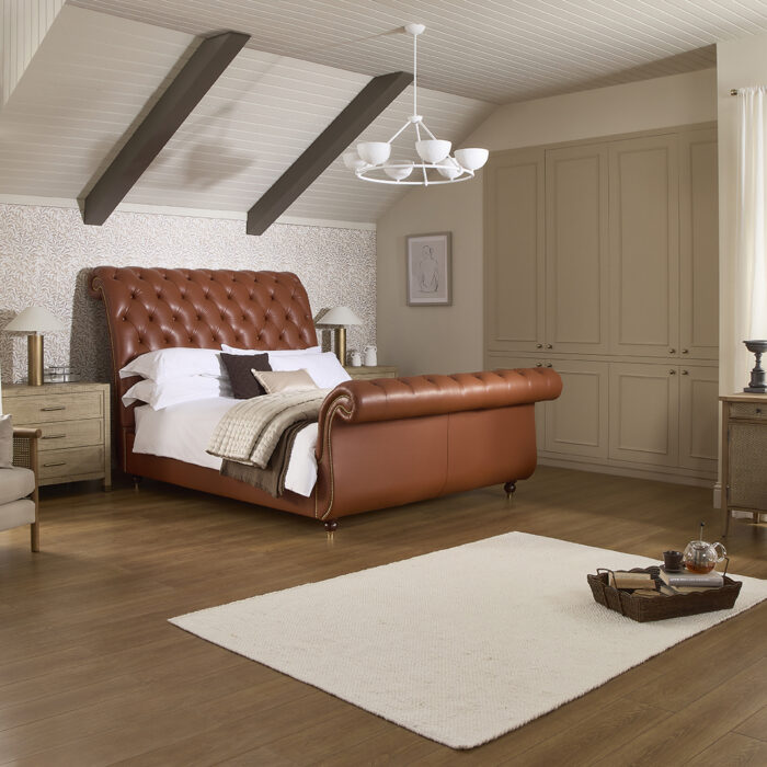 Herald leather sleigh bed with a traditional Chesterfield headboard and footboard | www.winstonsbeds.com