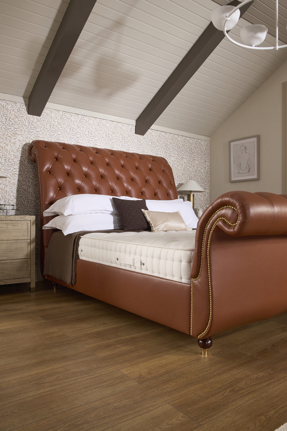 Classic Herald sleigh bed in leather with a deep buttoned Chesterfield headboard and footboard | www.winstonsbeds.com